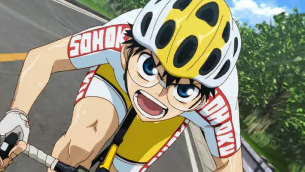 Kecepatan dan Ketegangan di Lintasan Balap Adegan balap sepeda dalam anime dengan grafik yang detail.